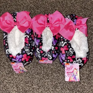3 of the Jojo Siwa Fuzzy Babba Slipper Socks